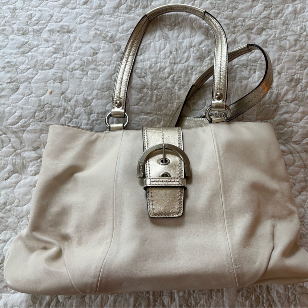 Coach bag, Ivory outside, light lavender liner. Great condition.